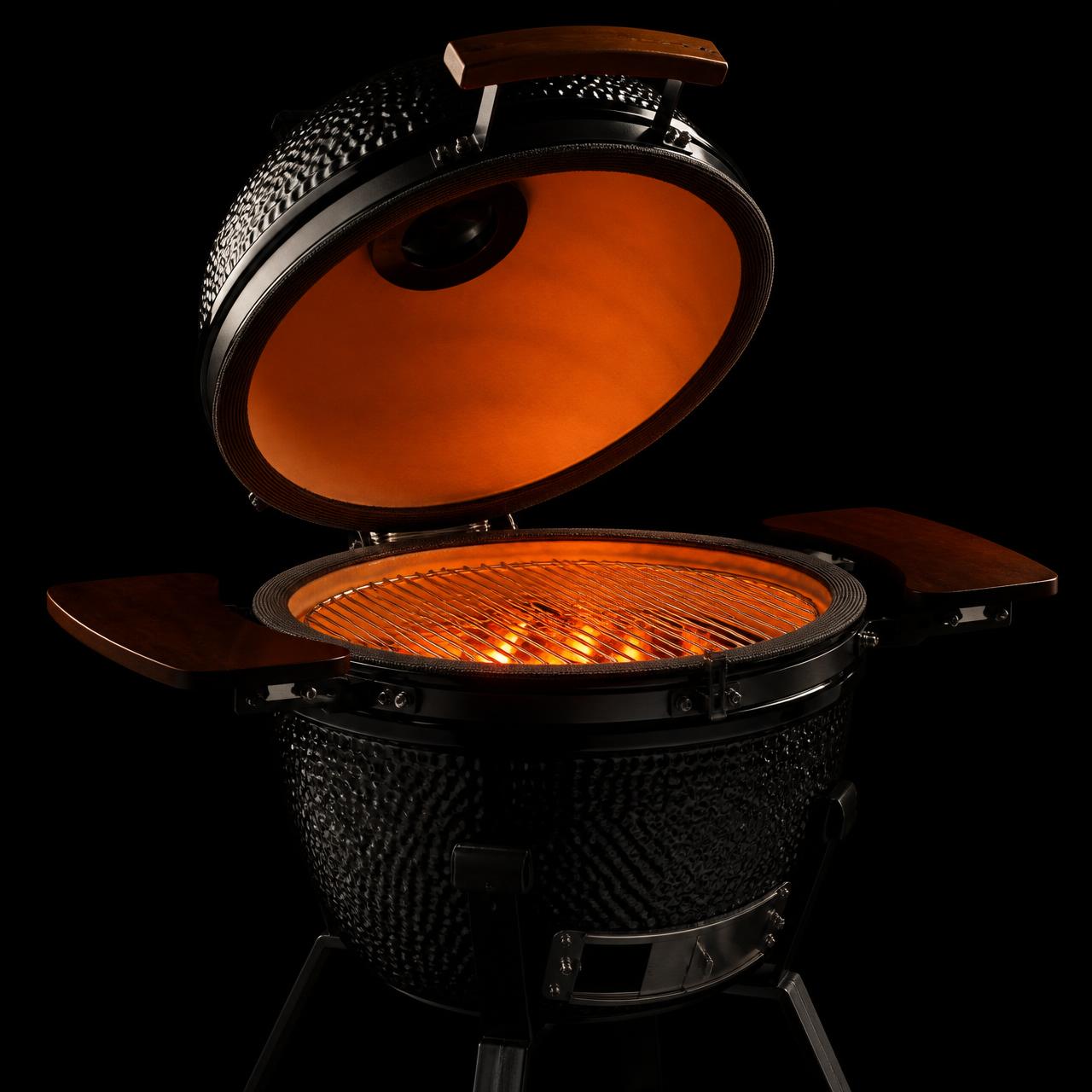 The Brute 13, lid open with glowing charcoal
